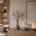 Zijden bessentakken van Silk Ka in beige vaas in een japandi stijl interieur 